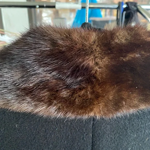 This is a cashmere winter coat with a mink fur collar made by saks